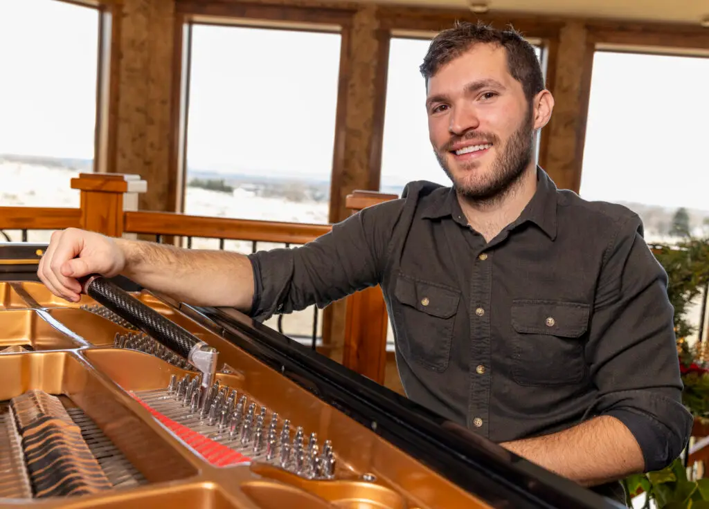 Jayden Ostler Tuning a Grand Piano